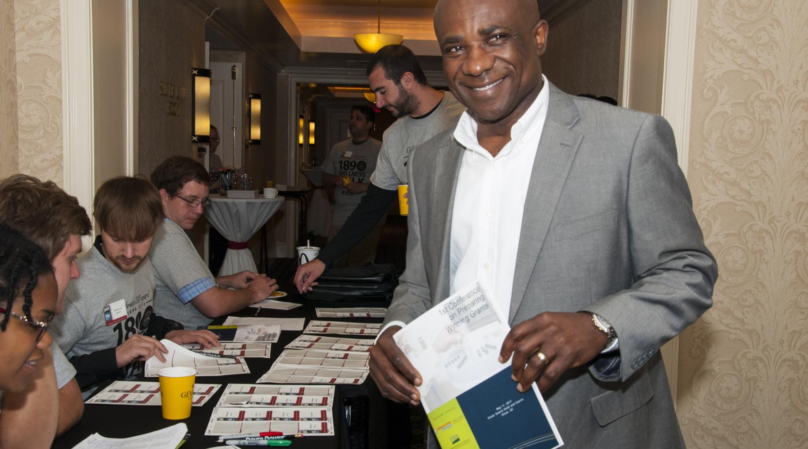 Attendees registering for conference.