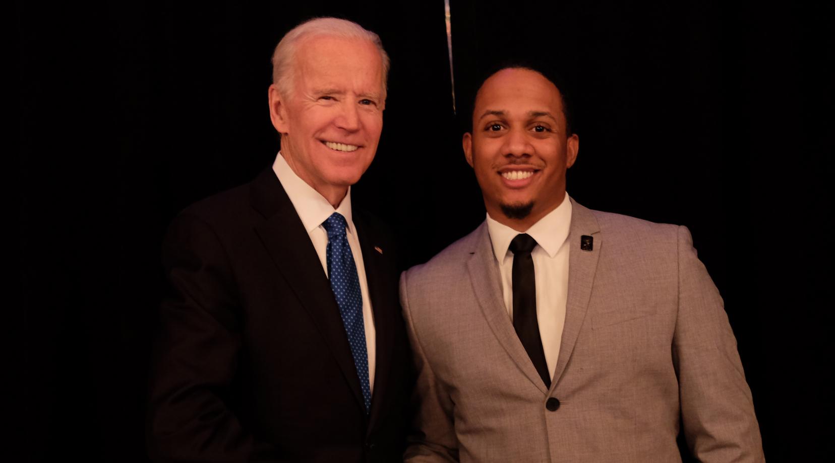 Former U.S. Vice President Joe Biden (l) congratulates Kyle Sheppard after presenting him the Biden Courage Award for his work at DSU to prevent sexual and domestic abuse.