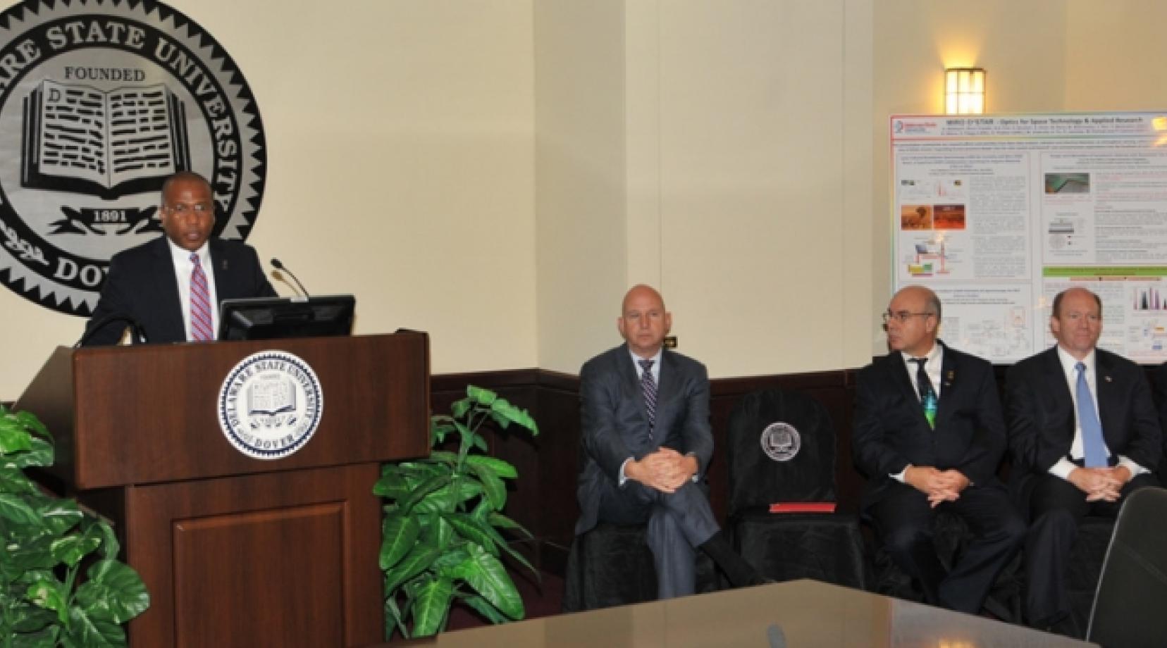 DSU President Harry L. Williams announces the $1.2 million grant awarded to the University by the Bill & Melinda Gates Foundation as Gov. Jack Markell, Dr. Noureddine Melikechi, U.S. Sen. Chris Coons and U.S. Rep. John Carney listen during a Oct. 26 media event.