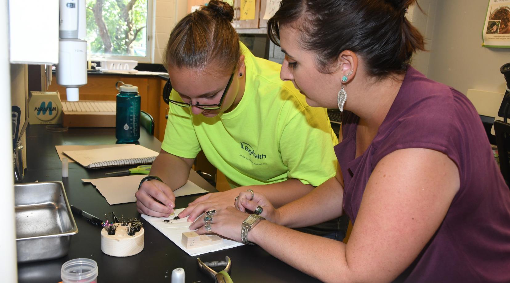 Dr. Krystal Hans (r), assistant professor and principal investigator of the three-year, $400,000 National Science Foundation grant, believes the funding will help students like the one she is working with in the lab to get the most out of DSU's Forensic Science Program.