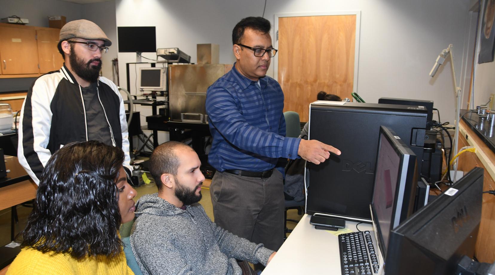 Dr. Mukti Rana (r), principal investigator of the grant, will provide these students -- (l-r) Larine Mbabit, Jaime Cardona and Kevin Diaz -- and others some hands-on research experience through this project.