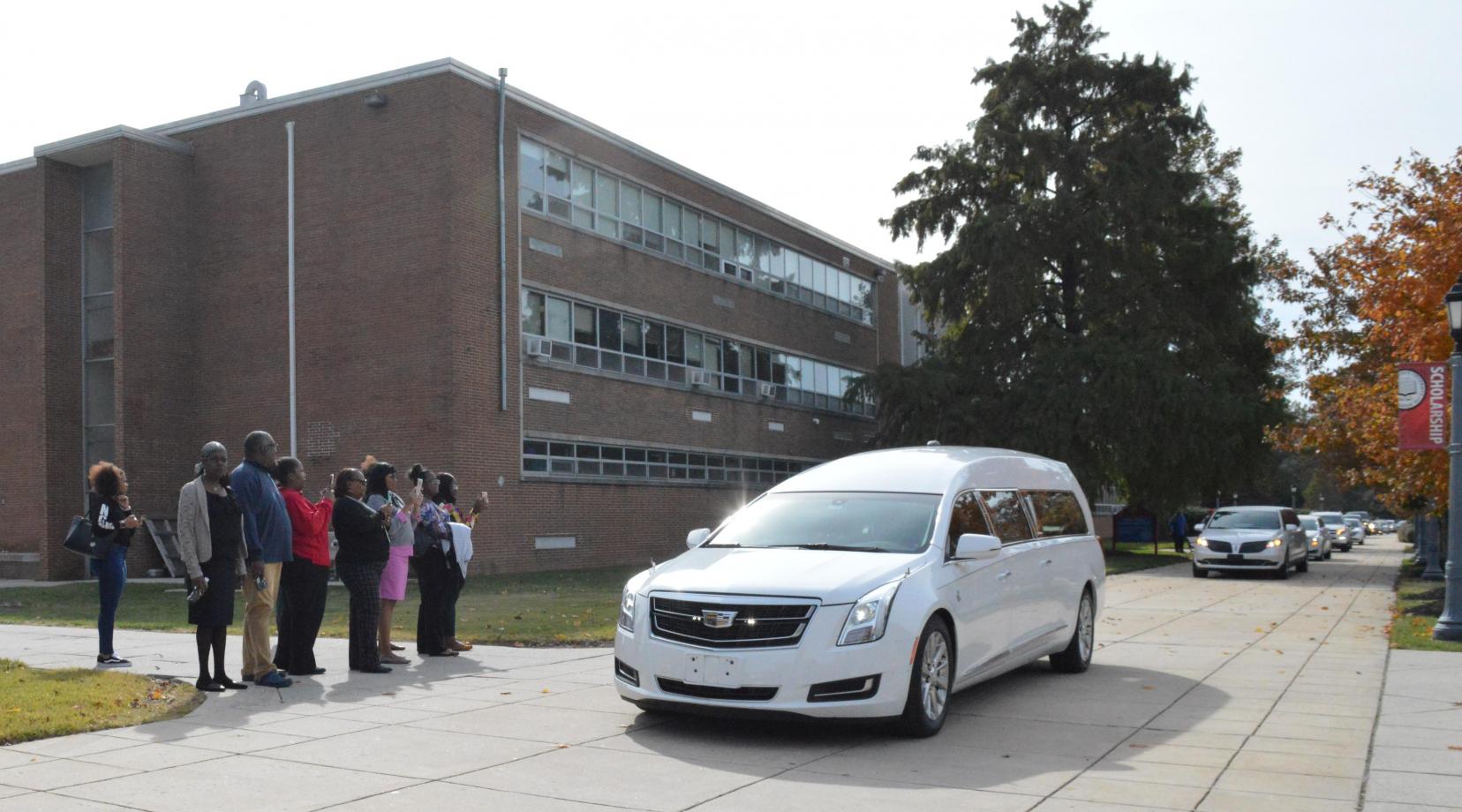 The hearse carrying the body of Dr. Ulysses S. Washington take the former longtime head of the Department of Agriculture and Natural Resource a final trip through the campus after the Celebration of Life service held in the Education and Humanities Theatre. Photo by Bernard Carr.