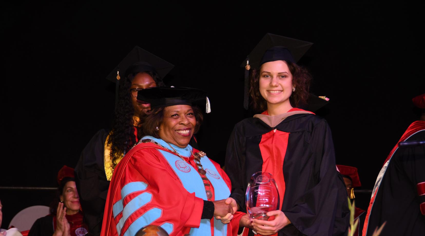 University President Wilma Mishoe stands with Elvira Galieva, who she presented both the Presidential Academic and Leadership awards during the December Commencement Ceremony.