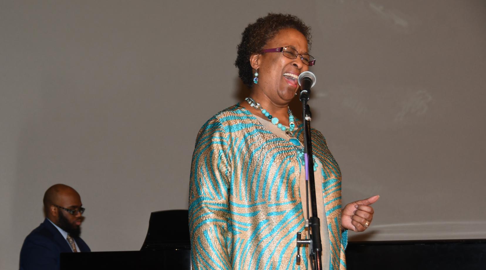 Dr. Marsha Horton, dean of the College of Health and Behavioral Sciences, puts on her music hat metaphorically and sings the National Anthem during the 33rd annual Martin Luther King Jr. National Holiday Program on campus. Photos by Judlin Pierre