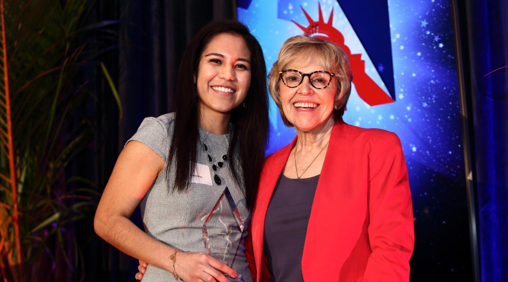 <p>Indira Islas (l), with her Holly Skolnick Human Rights Awards from the Americans for Immigrant Justice, stands with the Cheryl Little, the organization's executive director. Ms. Islas received the award at a Feb. 8 ceremony in Miami, Fla.</p>