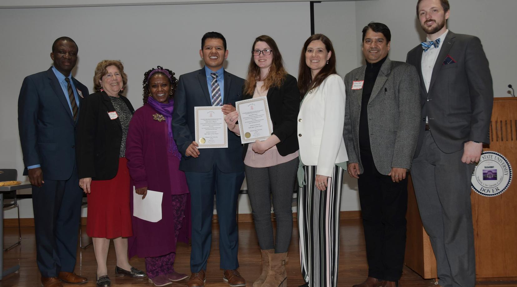 <p>(L-r) Dr. Daniel Awodiya, Dr. Myna German, Ava Perrine, newly inducted Lambda Pi Eta inductees Eddi Cabrera and Samantha Carter, Renee Marine, Maneesh Pandeya and Zak Kimbell. Mr. Cabrera and Ms. Carter were inducted in the honor society during the final session of MCVPA Day.</p>