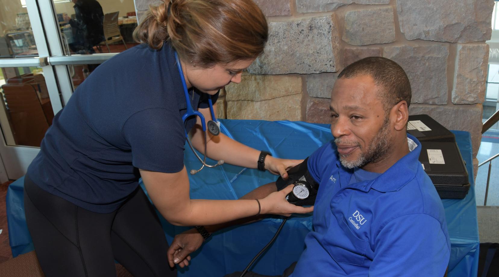 <p>One of DSU valued custodian Arron Brown takes a break to get his blood pressure check during the activities at the Public Health and Fitness Leaders' Day in the MLK Jr. Student Center.</p>
