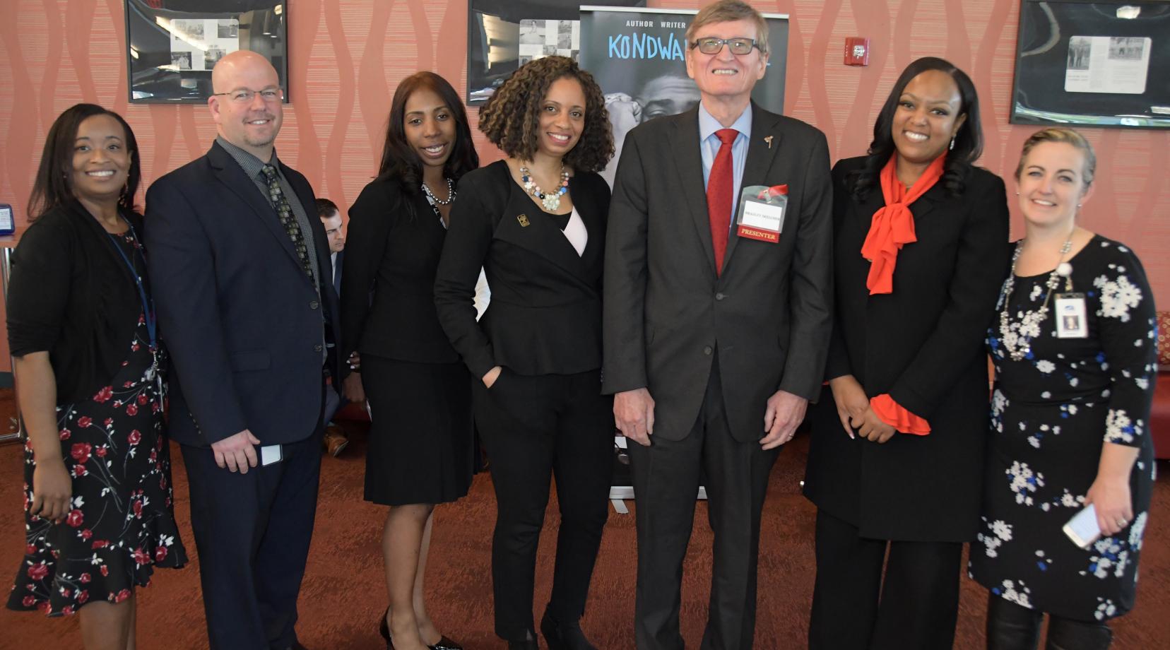 DOE's Tiffany Cireen Jon Nembauer, Raushawn, Shelly Rouser, retired University Associate Provost Bradley Skelcher and Education Department Chair Shelley Rouser, DOE's Monique Martin and Shannon Holston gather for a photo during the summit.