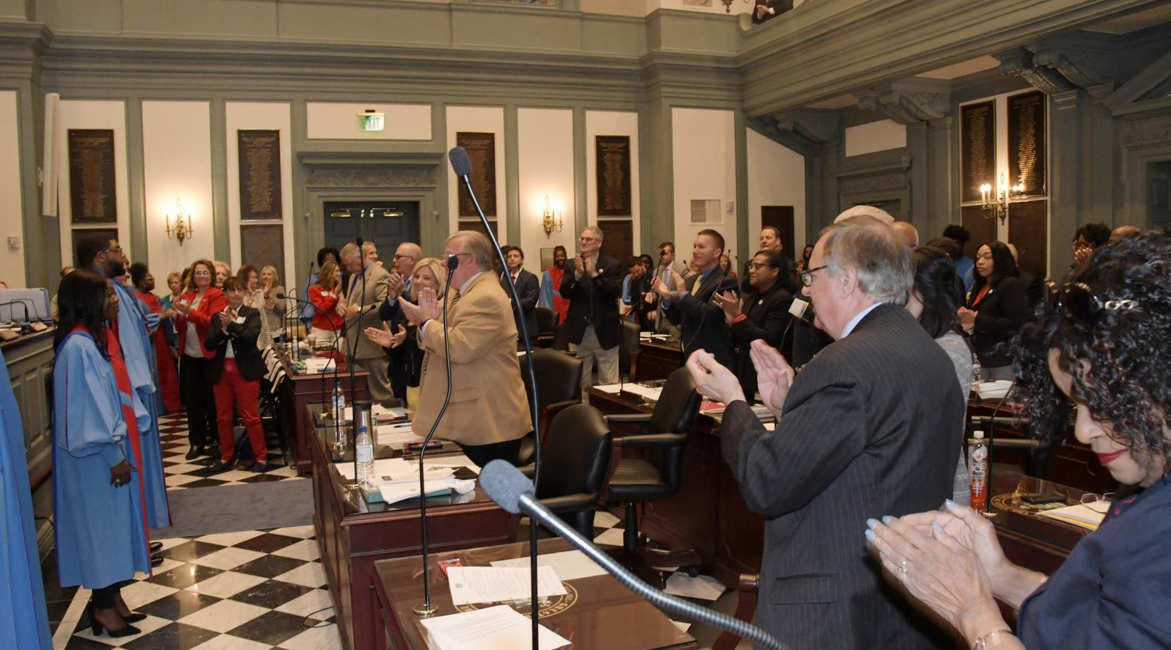 The University's Concert Choir receives a standing ovation from the House of Representatives following an April 17 performance.