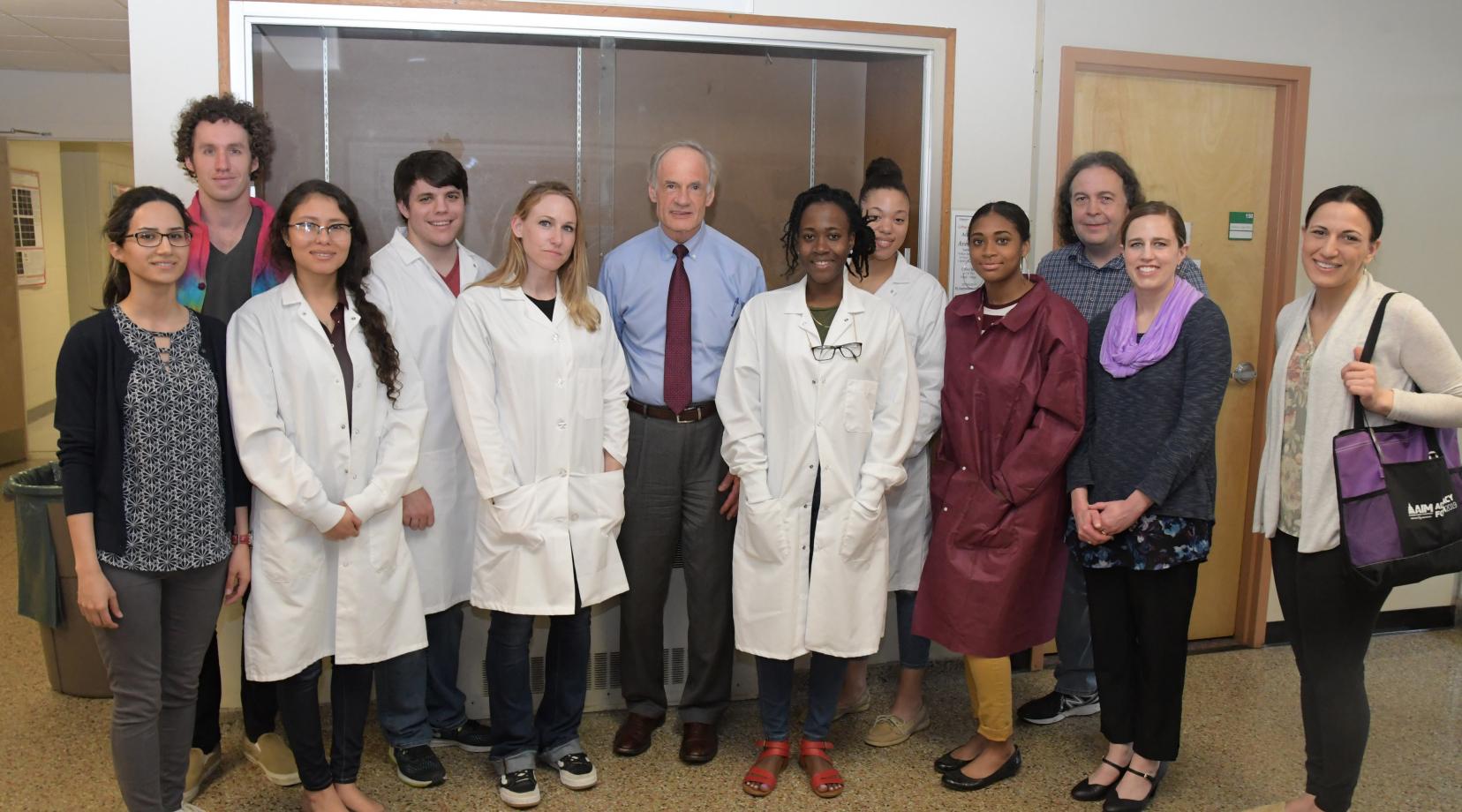 <p>U.S. Sen. Tom Carper poses with University faculty and students along with representatives of the Delaware Valley Chapter of the Alzheimer's Association during an April 19 visit to the campus.</p>