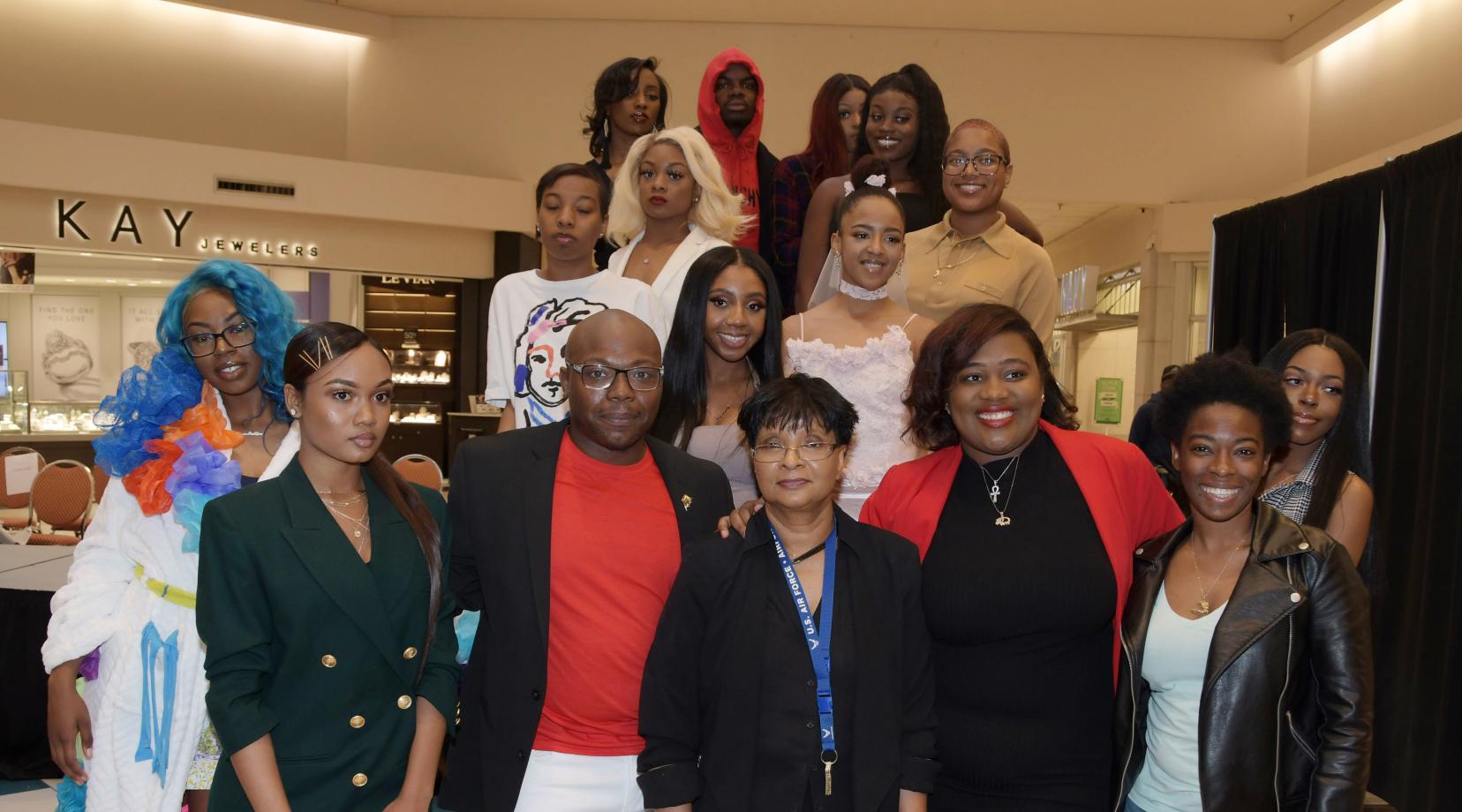 <p>These Textile and Apparel Studies students showed off their fashion designing creations during a April 27 show at the Dover Mall. Dr. Damayanthie Eluwawalage, assistant professor, (bottom row, third from the left), was so impressed by their work, she persuaded the Dover Mall executives to allow student to put on a fashion show there for the public.</p>