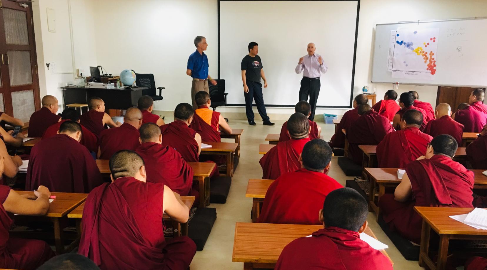 <p>Dr. Matthew Bobrowsky, director of the DSU Observatory and Science Outreach, teaches astronomy to a group of about 70 Tibetan monks during a recent trip to India.</p>