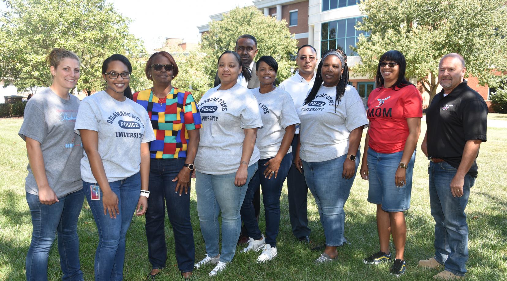 Members of the University Police Department show off their jean fashion statement in observance of "Denim Day", as part of Sexual Assault Awareness Day on Sept 25.