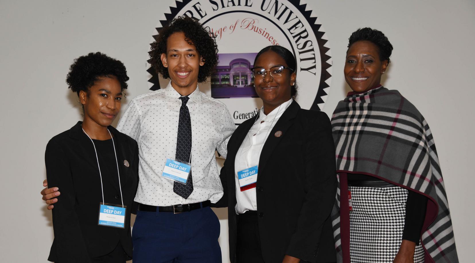 The Edwards Team won first place in the 2019 DEEP Day Business Case Competition. (L-r) Margarita Isbell, Madison Edwards, Anonda Speaks, and their coach Dr. Francine Edwards, dean of the College of Humanities, Education and Social Science.