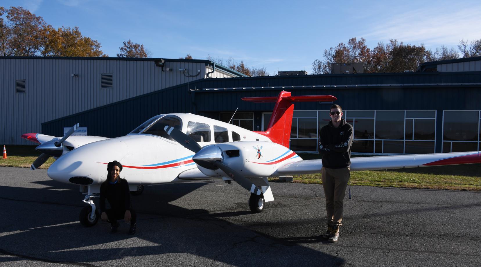 <p>Zaneasia Perry, freshman aviation major, and Lane Deleon, flight instructor and Aviation Program alumnus, pose next to the new twin-engine Piper Seminole recently delivered to the Aviation Program at the Delaware Air Park.</p>