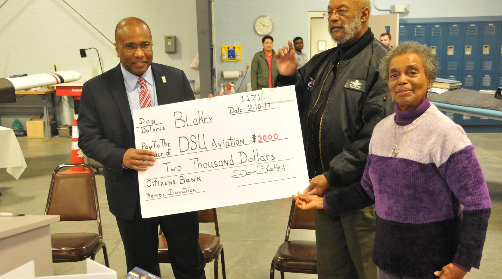 DSU President Harry L. Williams accept a check from Dr. Donald Blakey and his wife Dolores as a kick-off contribution for the newly launched Friends of the DSU Aviation Program fundraising campaign.