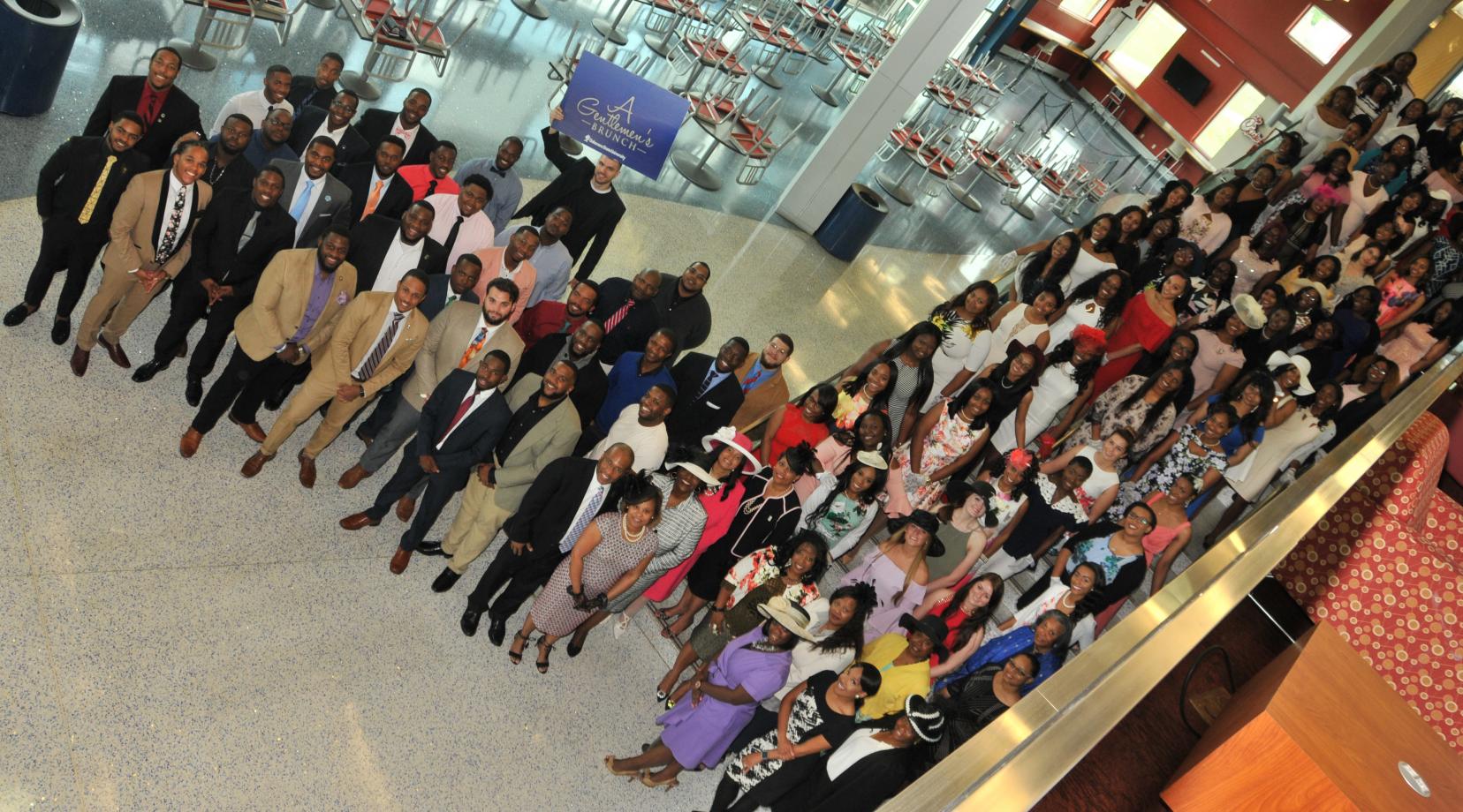 Although the graduating men and women attended separate luncheon events hosted by DSU President Harry L. Williams and First Lady Robin Williams, they came together for a joint photo opp.