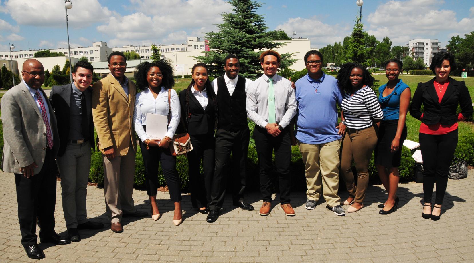 DSU President Harry L. Williams poses with the I-STARS students in Poland