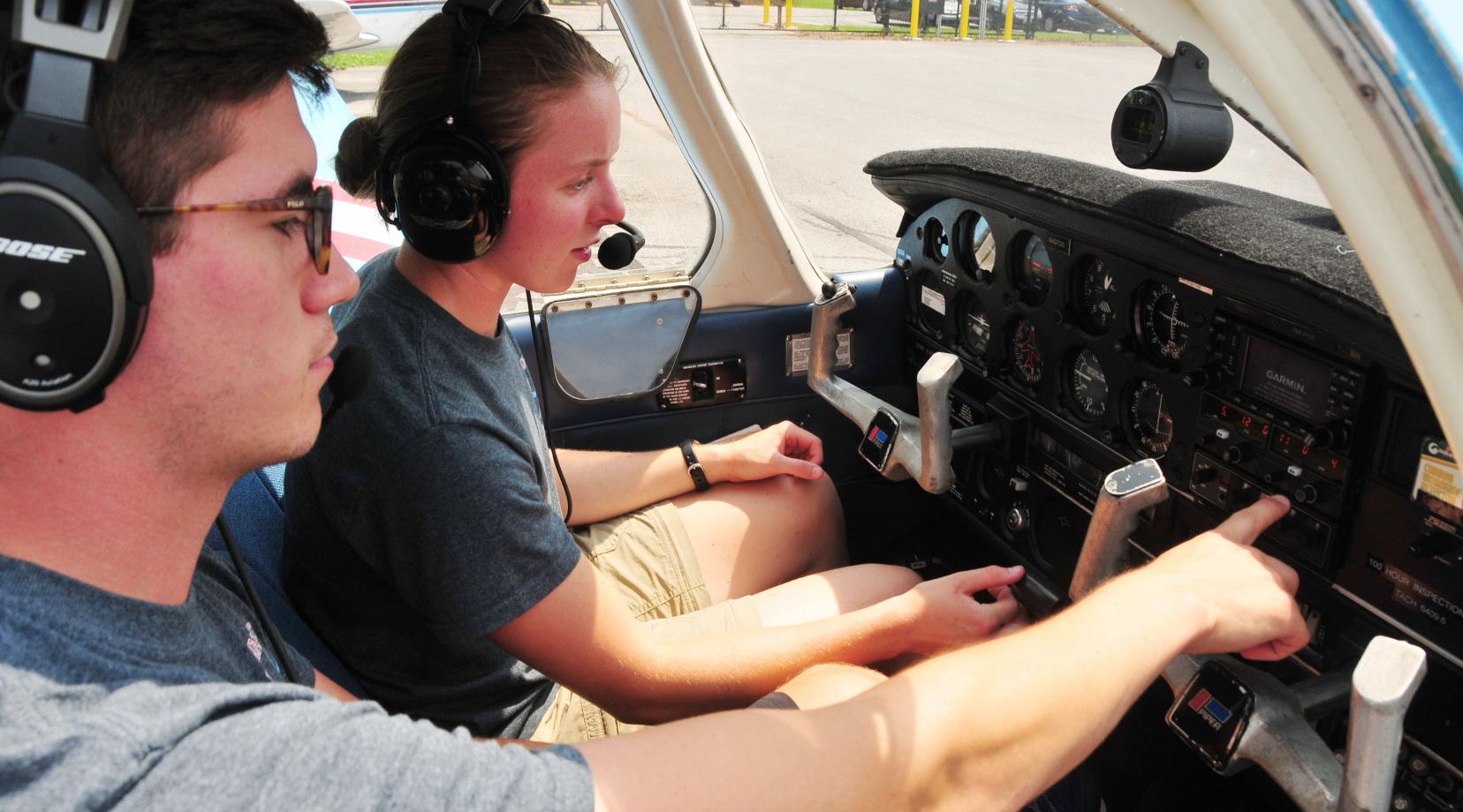 <p>Cadet Capt. Erin Dundas received cockpit instruction from DSU Aviation instructor Mark Ramos.</p>