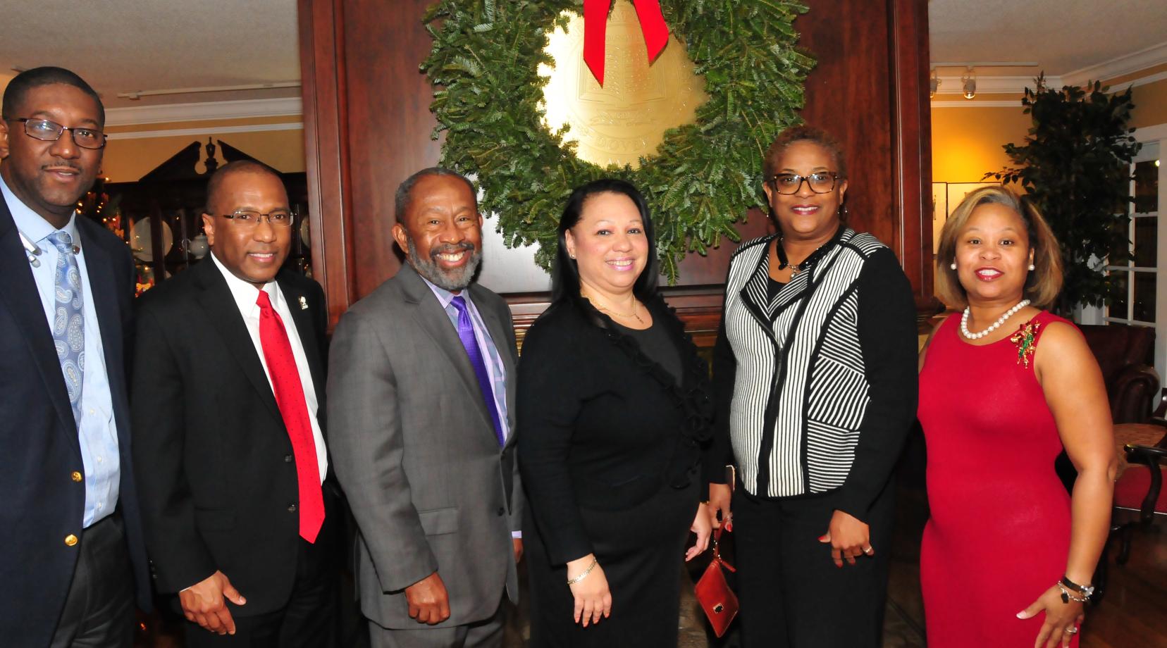 These DSU employees were one of many who took advantage of one more opportunity to get their picture taken with the DSU president and the First Lady during the annual Christmas Open House.