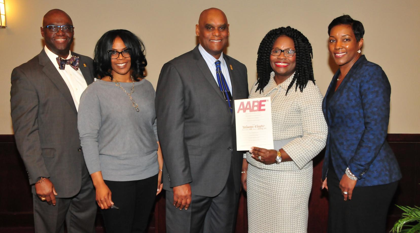 John Allen of Delmarva Power, along with Amber Young, William Pickrum, Enid Wallace-Simms, secretary, vice president and president, respectively; along with Paula Glover, national AABE president/CEO, celebrate the new Delaware AABE Chapter.