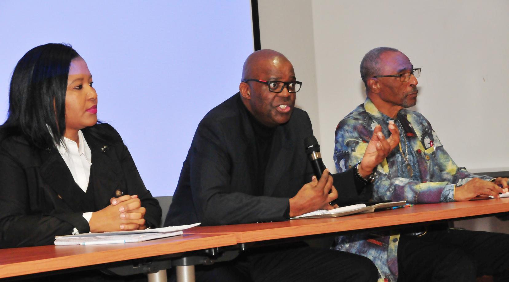 Dr. Eddy Maloka (center), CEO of the African Peer Review Mechanism, fields a question from the audience of DSU students. He is flanked by Tumi Dlamini (l), Dr. Maloka's advisor, and C. Gregory Turner, of Kool-Baker Global, a firm that invests in businesses in Africa.