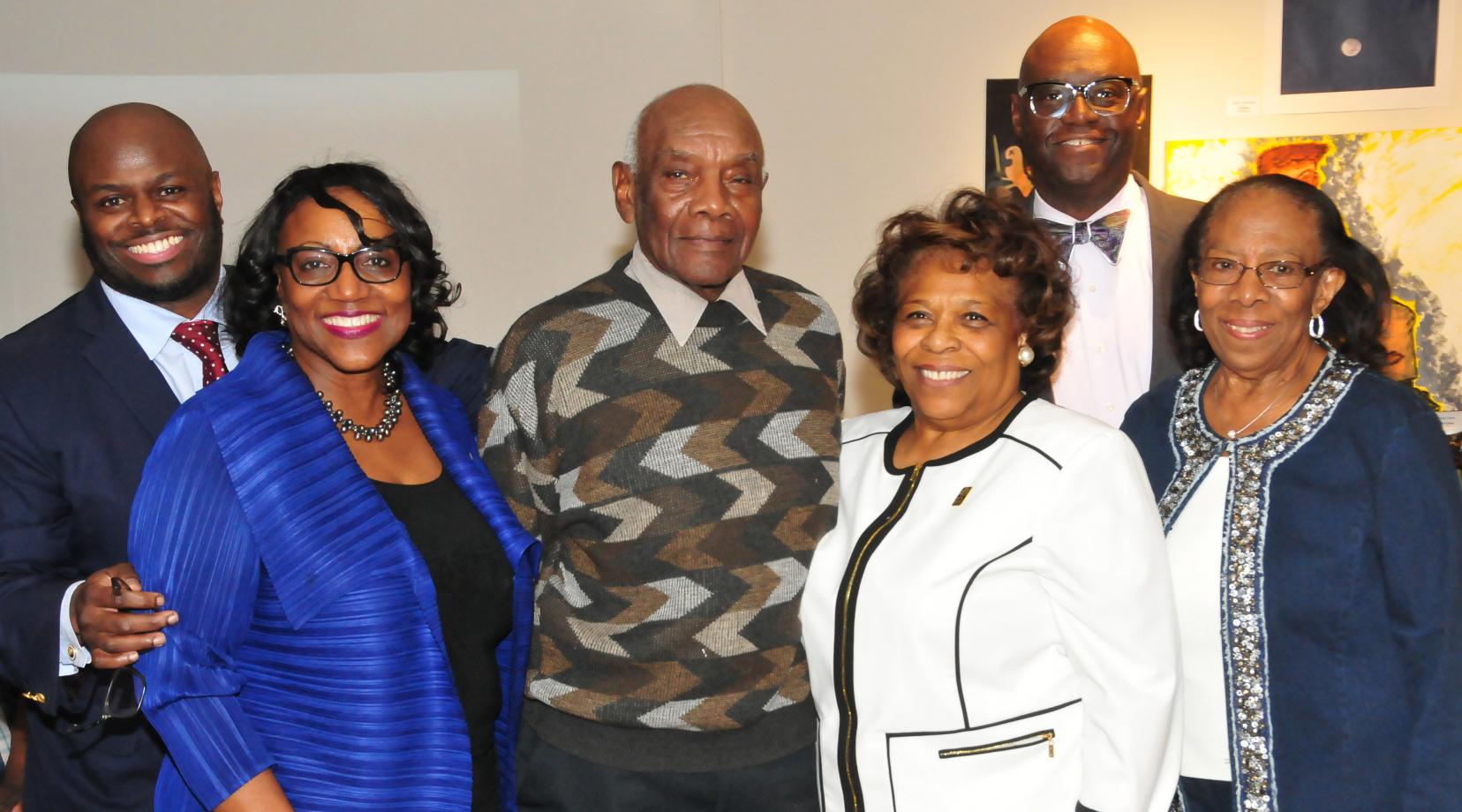 <p>(L-r) Provost Tony Allen, Institutional Advancement VP Vita Pickrum, Douglas Gibson, DSU Acting President Wilma Mishoe, DSU Trustee John Allen and DSU alumna Reba Hollingsworth gather at a reception in honor of Mr. Gibson and his hand-carved duck art. Mr. Gibson donated 10 works to the University.</p>