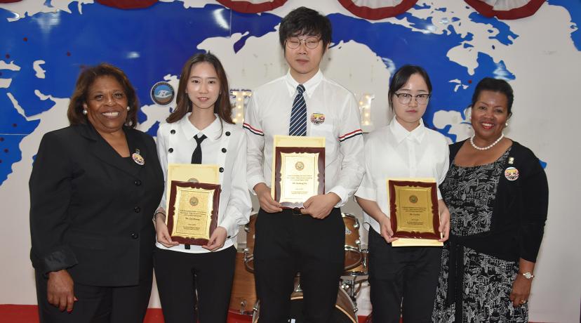 <p>Three students – Ziyi Zhang, Senfeng Xu and Lu Dai – were presented with Delaware State University’s Presidential Academic Excellence Award. They are pictured with Dr. Wilma Mishoe and Dr. Devona Williams.</p>
