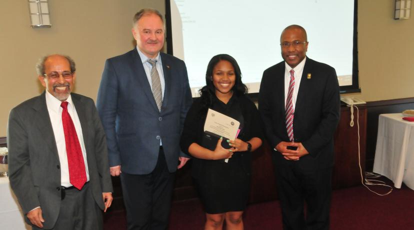 <p>(L-r) Dr. Mazen Shahin, AMP director; Prof. Adam Gadomski, vice rector for UTP International Relations and Ms. Casey's research mentor in Poland; Tahlia Casey and DSU President Harry L. Williams. Prof. Gadomski came to DSU to present to Ms. Casey the published papers she helped co-author.</p>
