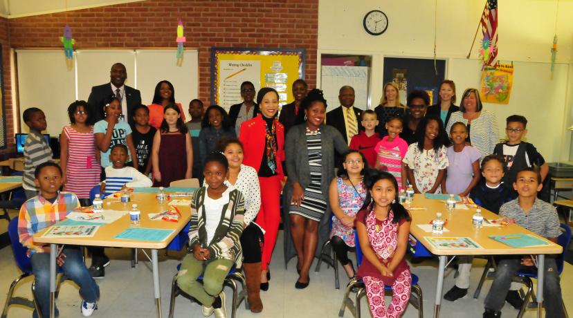 <p>Del. Congresswoman Lisa Blunt Rochester and Ciara Martin, DSU nutrition educator (both in the center), join students of Towne Point Elementary School and others for a photo after teaching about healthy and unhealthy drink choices.</p>